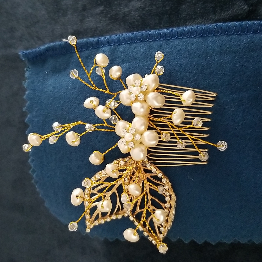 Wedding hair accessory.  Gold colored with crystals and white pearls.